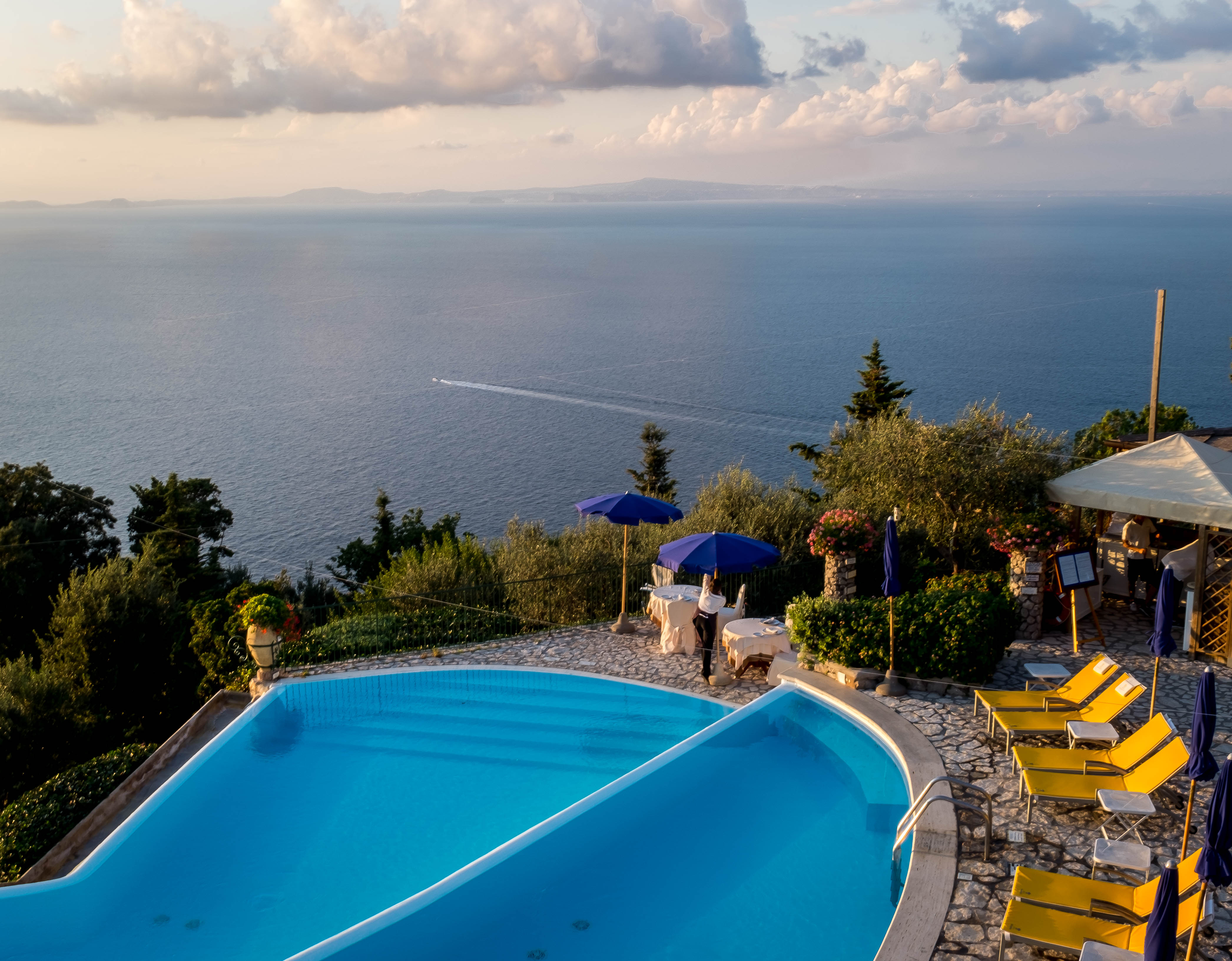Infinity pool above the sea at dusk, Capri