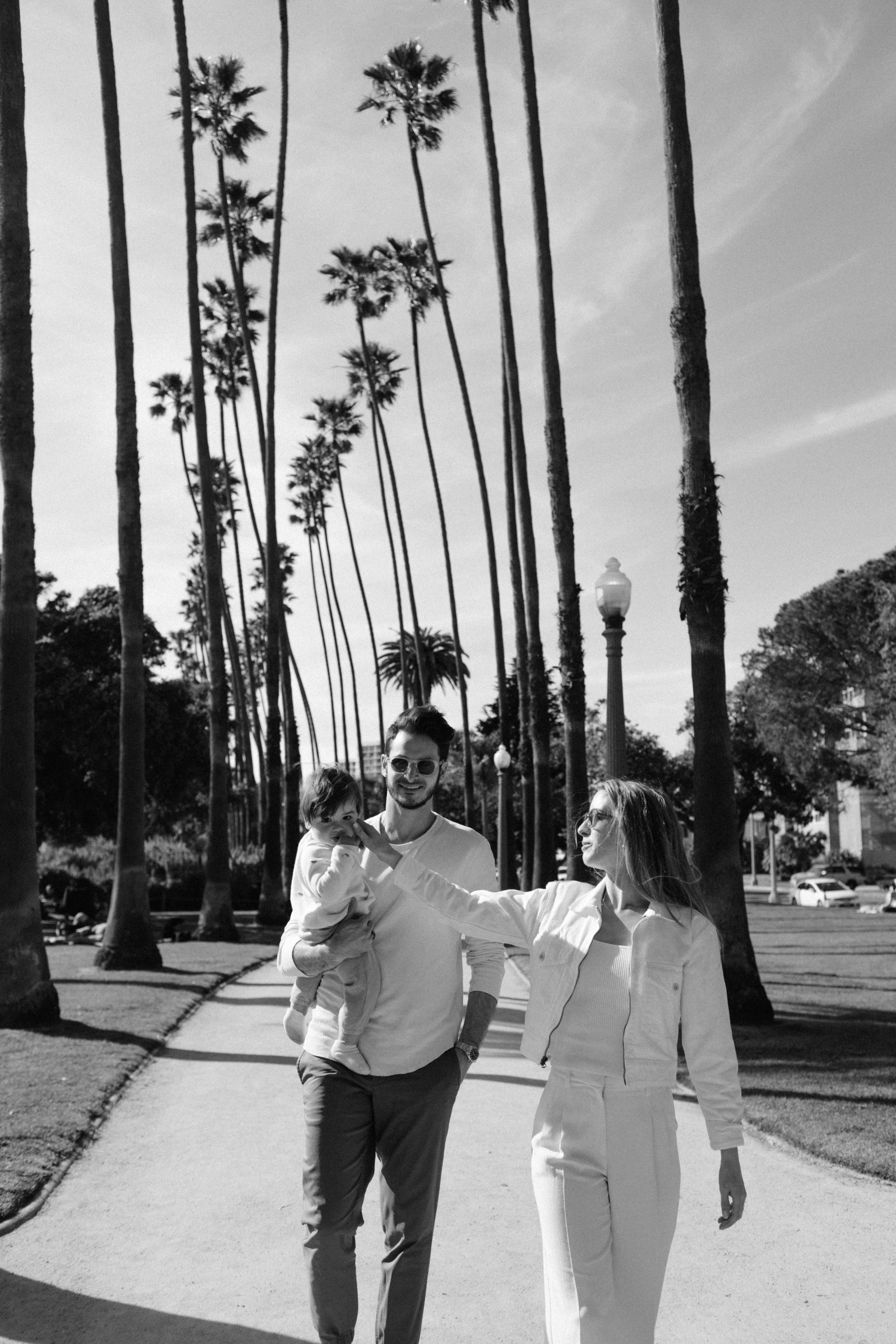 The Wasser family on a palm-lined walk, Manhattan Beach