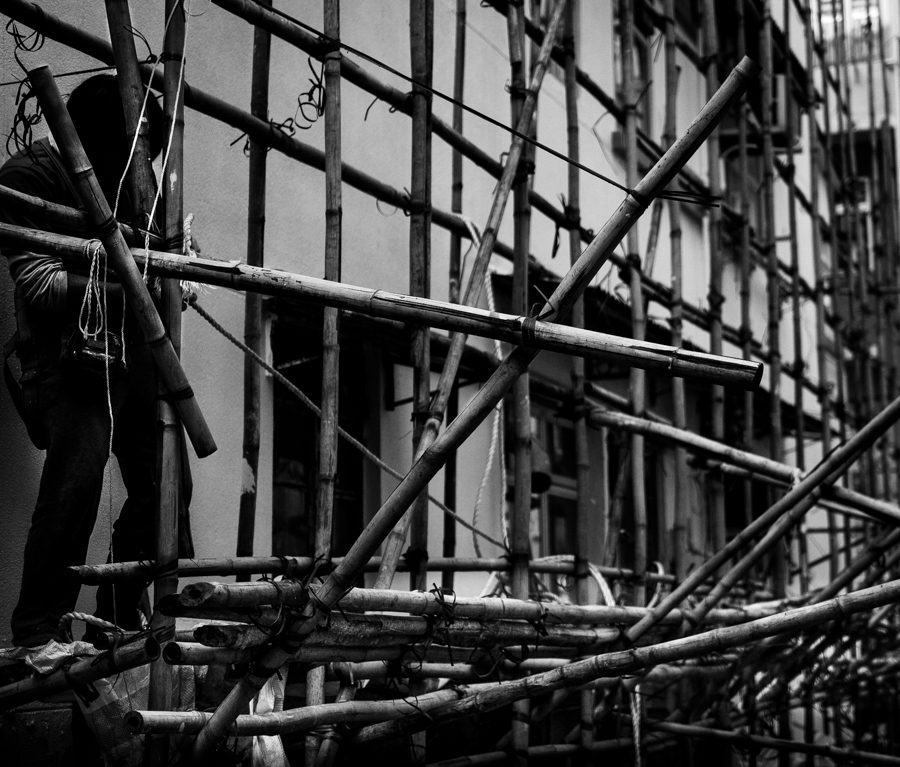 Worker on bamboo scaffolding, Hong Kong